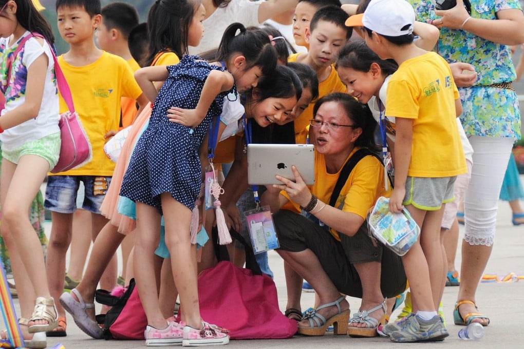 Chinese children learn about Chinese history on a visit to Tiananmen Square, in Beijing, while attending a summer camp. Photo: SCMP Pictures