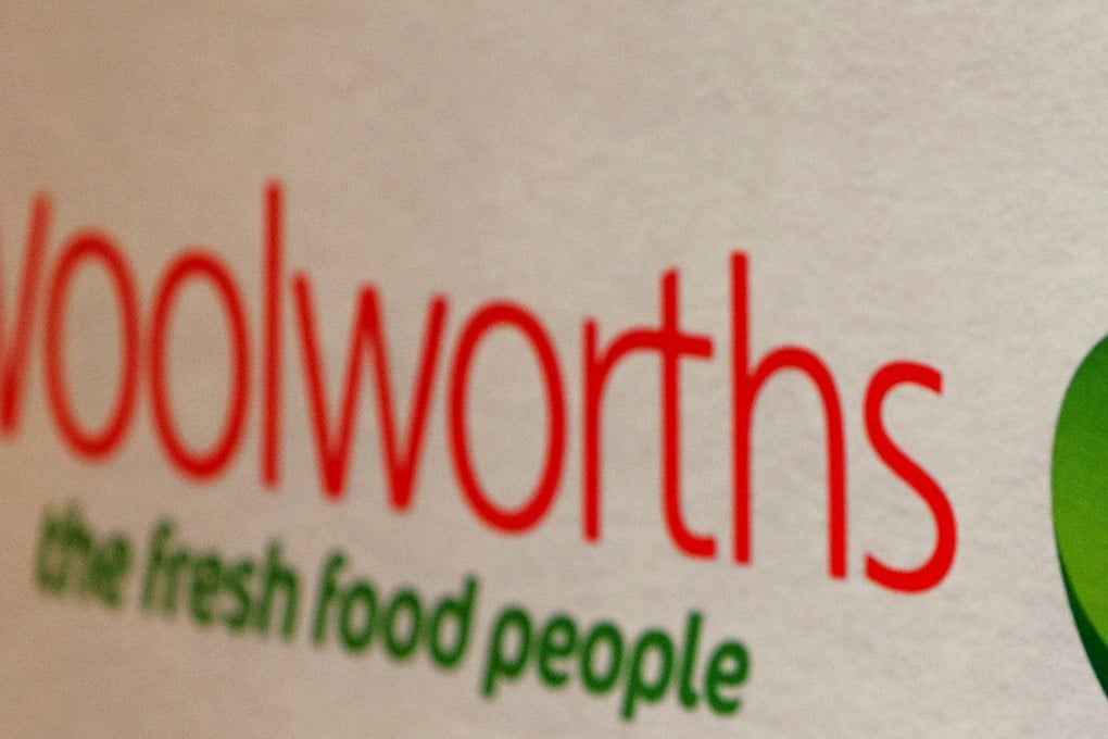 The logo of Woolworths in Australia, where the retailer sharply cut its profit forecast and said its CEO will be stepping down. Photo: AFP
