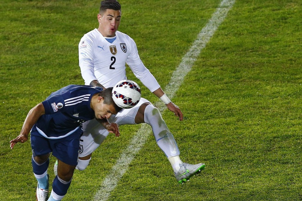 Sergio Aguero sticks his head in to score for Argentina. Photo: EPA