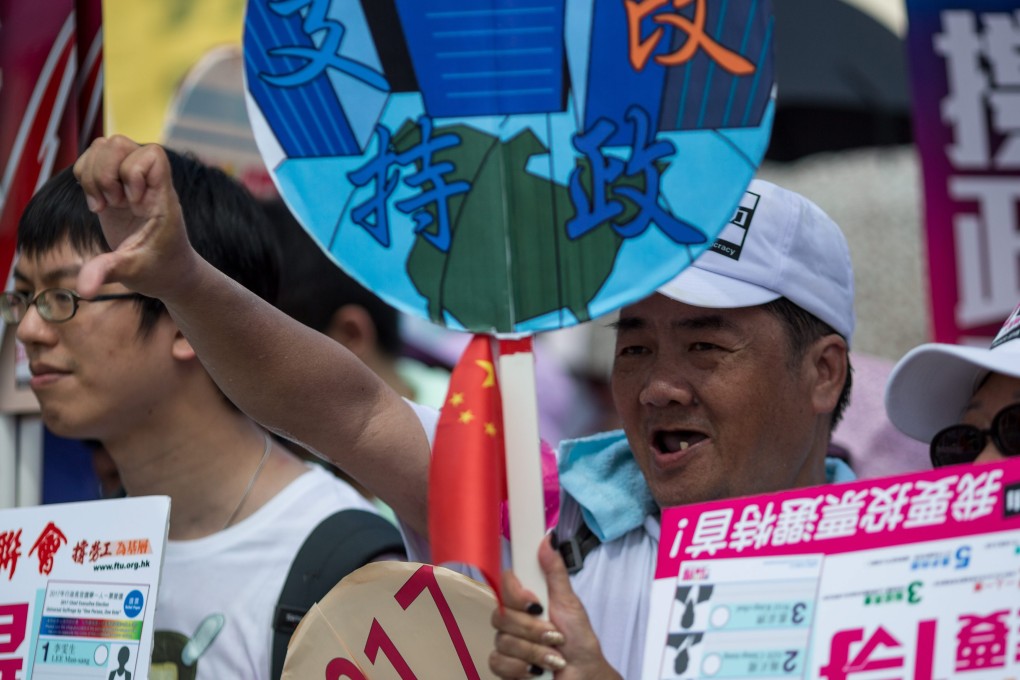 Pro-government protesters join the rally outside Legco. Photo: EPA