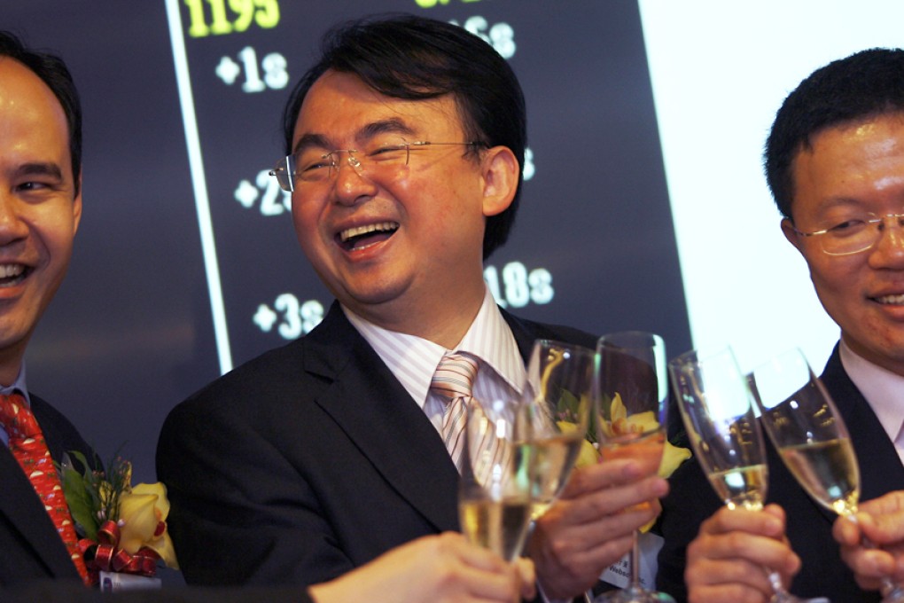 After listing the online games developer in 2008, NetDragon chairman Liu Dejian (centre) now seems bent on snapping up educational content and related technology firms. Photo: Jonathan Wong
