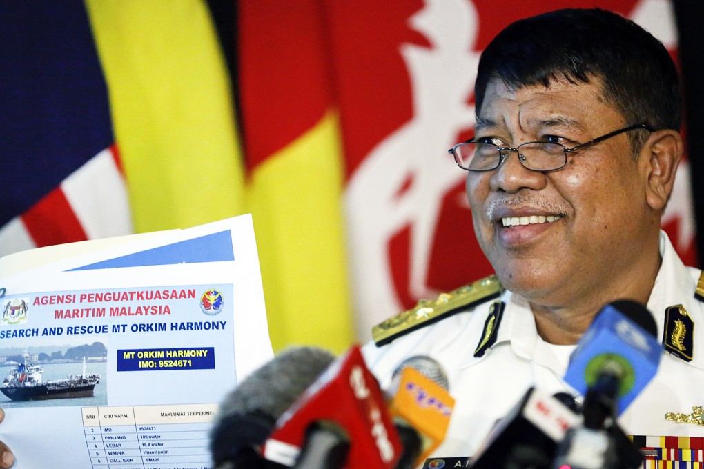 The deputy director of the Malaysian Maritime Enforcement Agency, Ahmad Puzi Abdul Kahar, shows a picture of missing tanker. Photo: AP