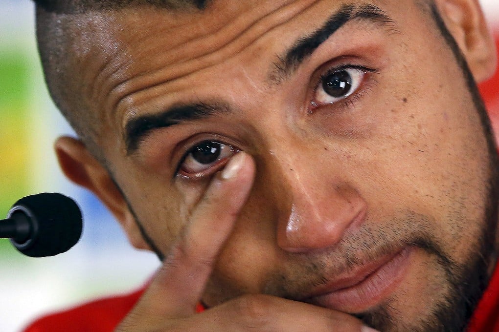 Arturo Vidal's demeanour was in stark contrast to YouTube video of him berating police. Photo: Reuters