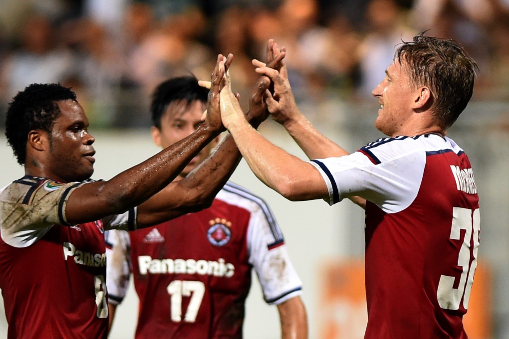 South China's Daniel McBreen celebrates with teammate Mahama Awal after their 2-0 win over Bengaluru of India in their AFC Cup last-16 match. Photo: Xinhua
