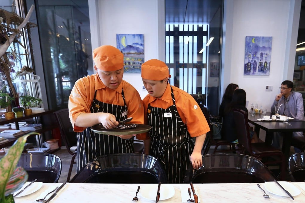 Worker Tsui Man-leung and trainee Lo Kwok-wai at the iBakery Cafe. Photo: Jonathan Wong