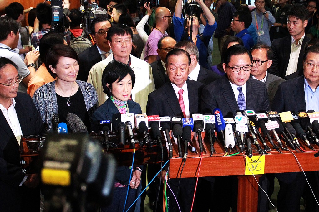 Pro-Beijing legislators Ip Kwok-him, Starry Lee, Regina Ip, Lau Wong-fat, Jeffrey Lam, and Tam Yiu-chung meet the press after the reform package was rejected on Thursday. Photo: May Tse