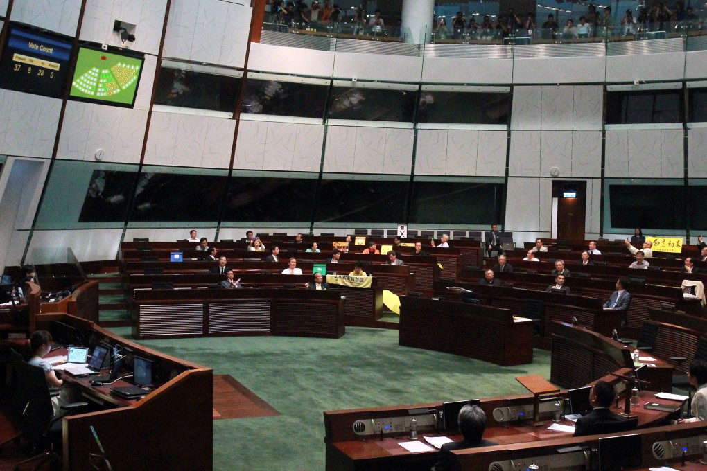 Hong Kong reform package rejected as pro-Beijing lawmakers walk out from the Legco Chamber before vote. Photo: May Tse