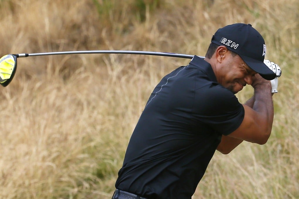 Tiger Woods slams his driver into the ground after missing the fairway on the eighth hole at the US Open. He finished at 10-over 80, 15 shots behind leaders Henrik Stenson and Dustin Johnson. Photo: AP