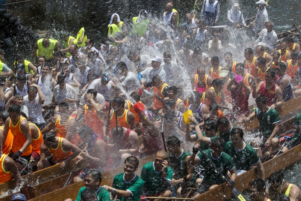Participants splash water from their dragon boats as part of a celebration to mark the annual Tuen Ng or Dragon Boat Festival at Aberdeen. Photo: Reuters
