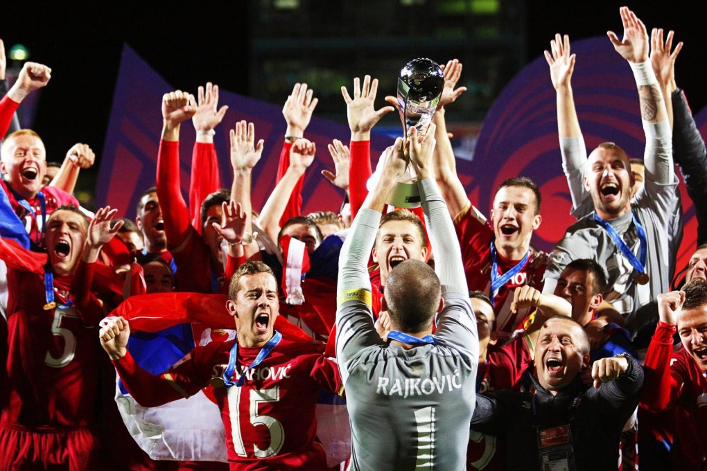 Serbia captain Predrag Rajkovic lifts the trophy as teammates celebrate beating Brazil in the final of the Fifa Under-20 World Cup in Auckland, New Zealand. Photos: EPA
