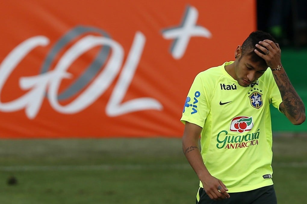 Neymar hangs his head at a training session ahead of the announcement of his ban. Photo: EPA