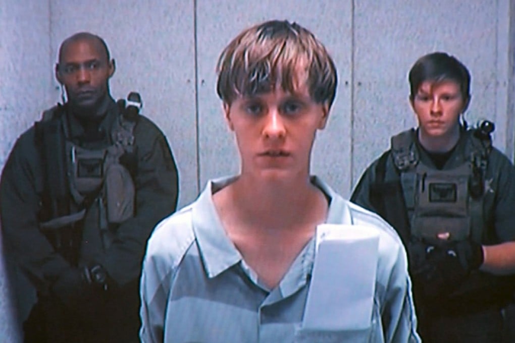 Suspected shooter Dylann Storm Roof (centre) appears by closed-circuit televison at his bond hearing in Charleston, South Carolina. Photo: Reuters