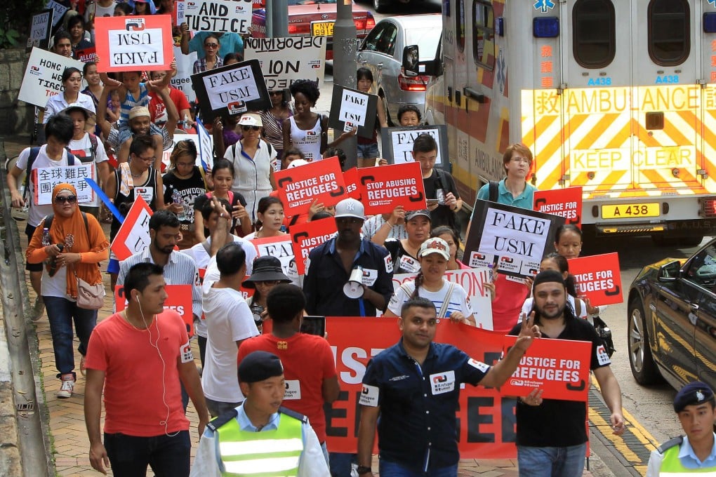 Concern groups march to Immigration Tower in Wan Chai from the Central ferry piers during World Refugee Day. Photo: Franke Tsang
