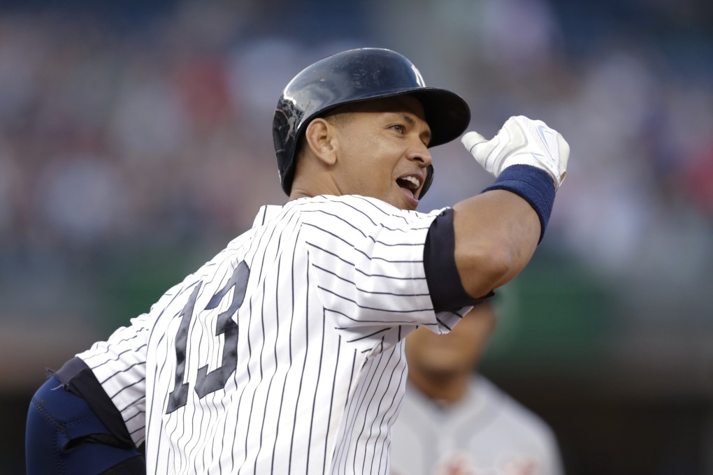 Alex Rodriguez gestures to the crowd after hitting a home run for his 3,000th career hit. Photo: AP