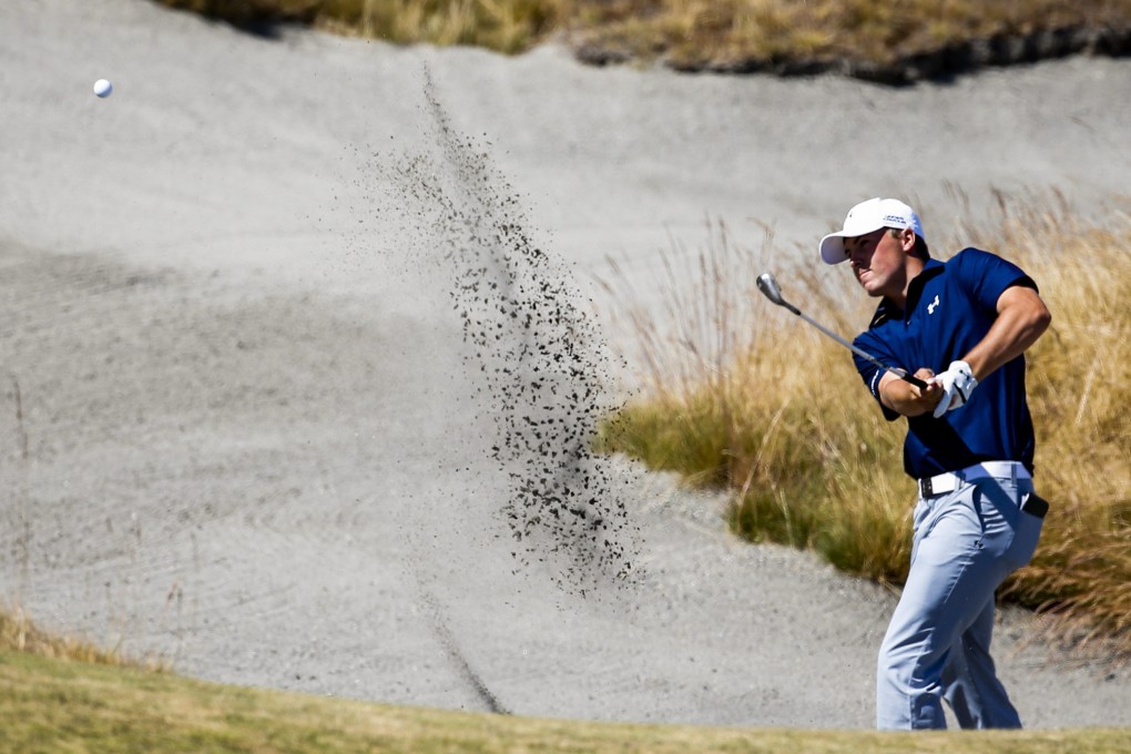 Jordan Spieth hits from a bunker on the 18th hole during the second round. Photo: EPA