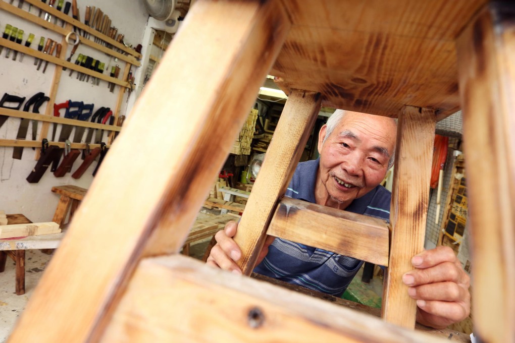 Lung Man-cheun is in his element working with old tools in his workshop in To Kwa Wan. Photo: Nora Tam