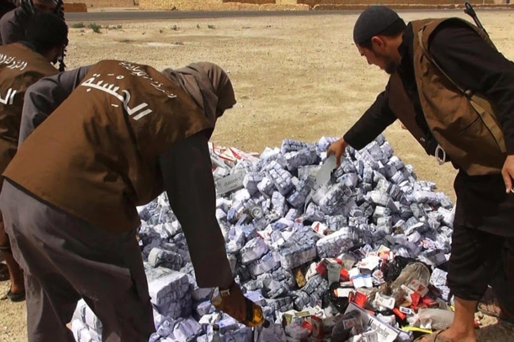 Hisba members prepare to burn cigarettes in Syria.Photo: AP