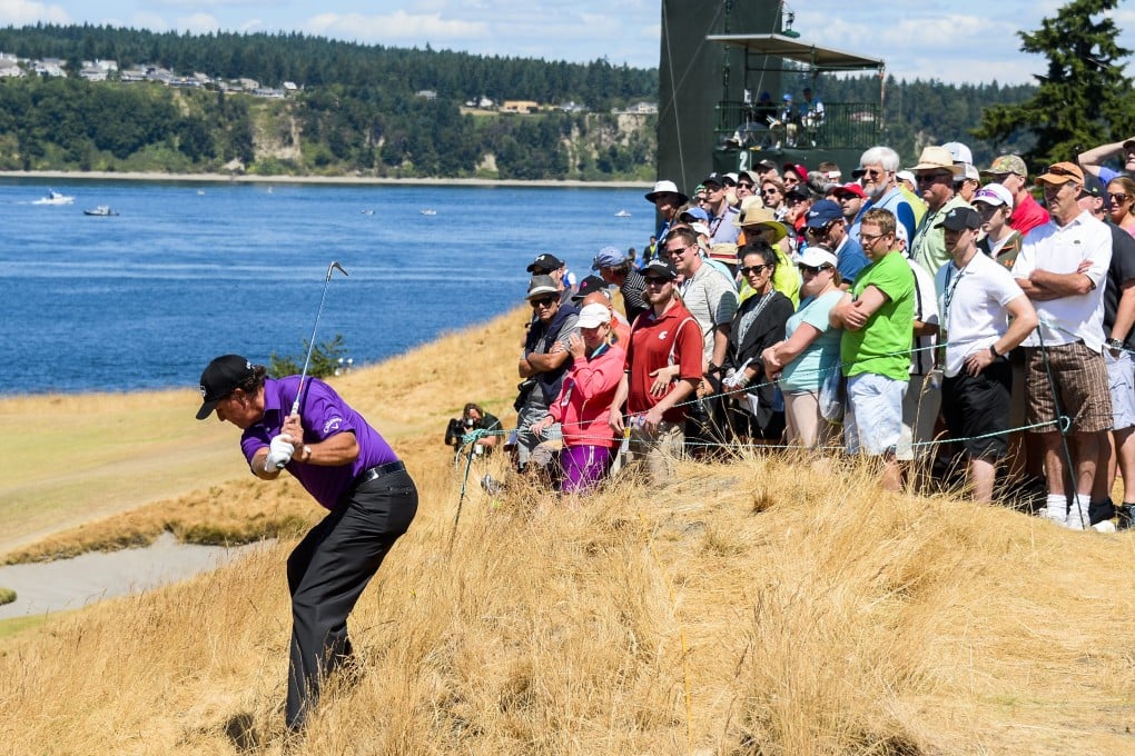 Phil Mickelson hits from a tough spot during the third round of the 115th US Open at Chambers Bay in University Place, Washington. Photo: EPA