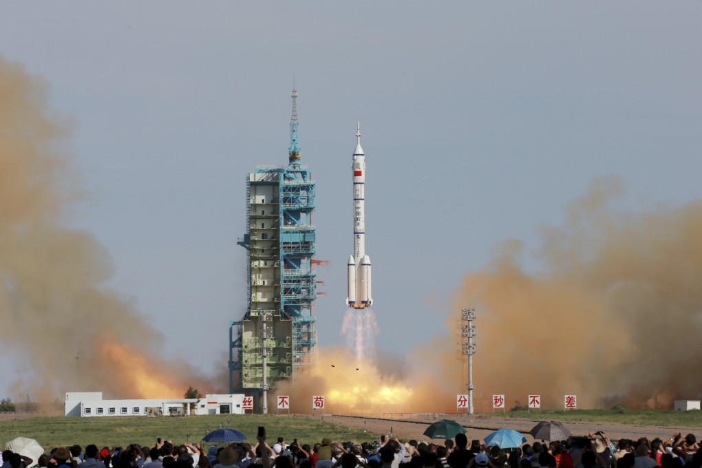 Three Chinese astronauts blast off in a rocket in 2013 at the start of a 15-day mission to dock with the nation's experimental space laboratory. Photo: Xinhua
