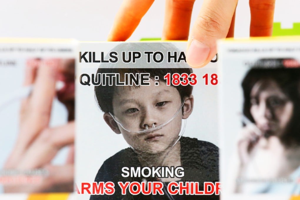 People in Causeway Bay were asked to sign up to this type of graphic warning on cigarette packs. Photo: Nora Tam