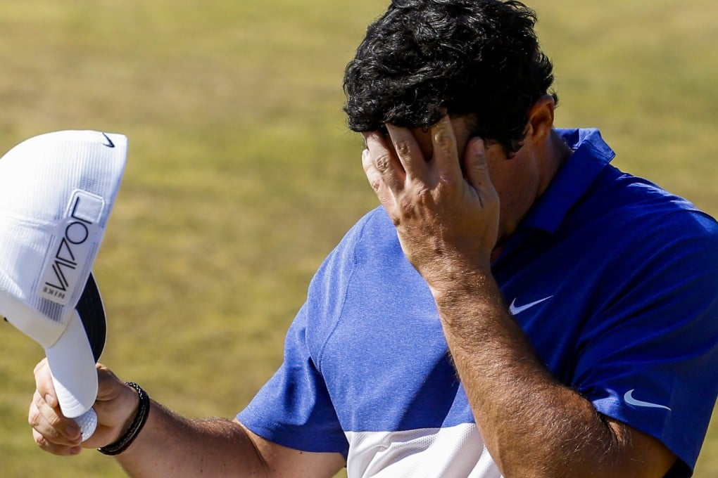Rory McIlroy reacts as he makes bogey on the seventeenth hole. Photo: EPA