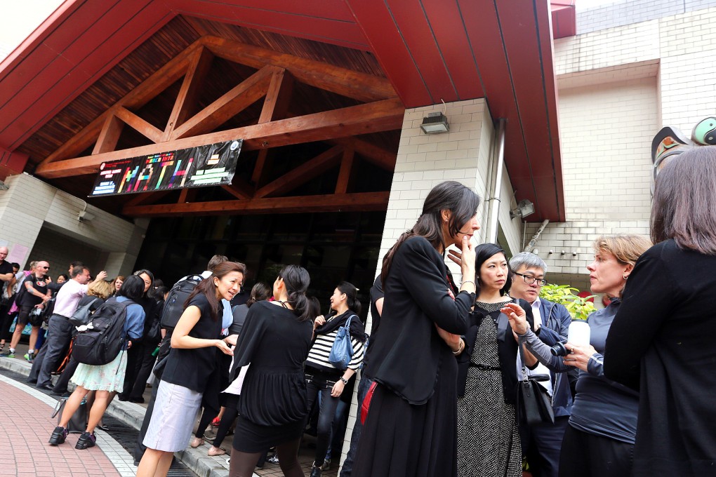 Parents dress in black to rally at the Canadian International School, demanding answers over the sacking of senior teachers. Photo: Sam Tsang