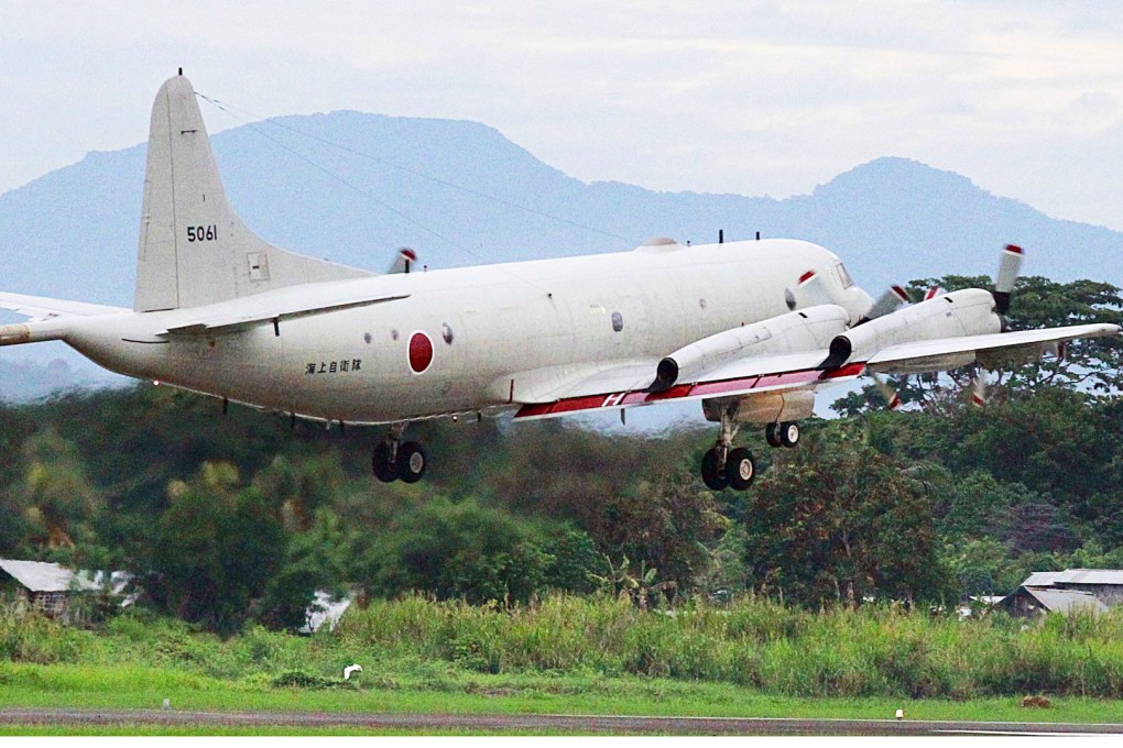 A Japanese Maritime Self-Defence Force P-3C patrol plane takes off from an airport in Puerto Princesa on Palawan Island in the western Philippines on Tuesday, to participate in joint exercises with Philippine forces in the face of China's growing assertiveness in the South China Sea. Photo: Kyodo