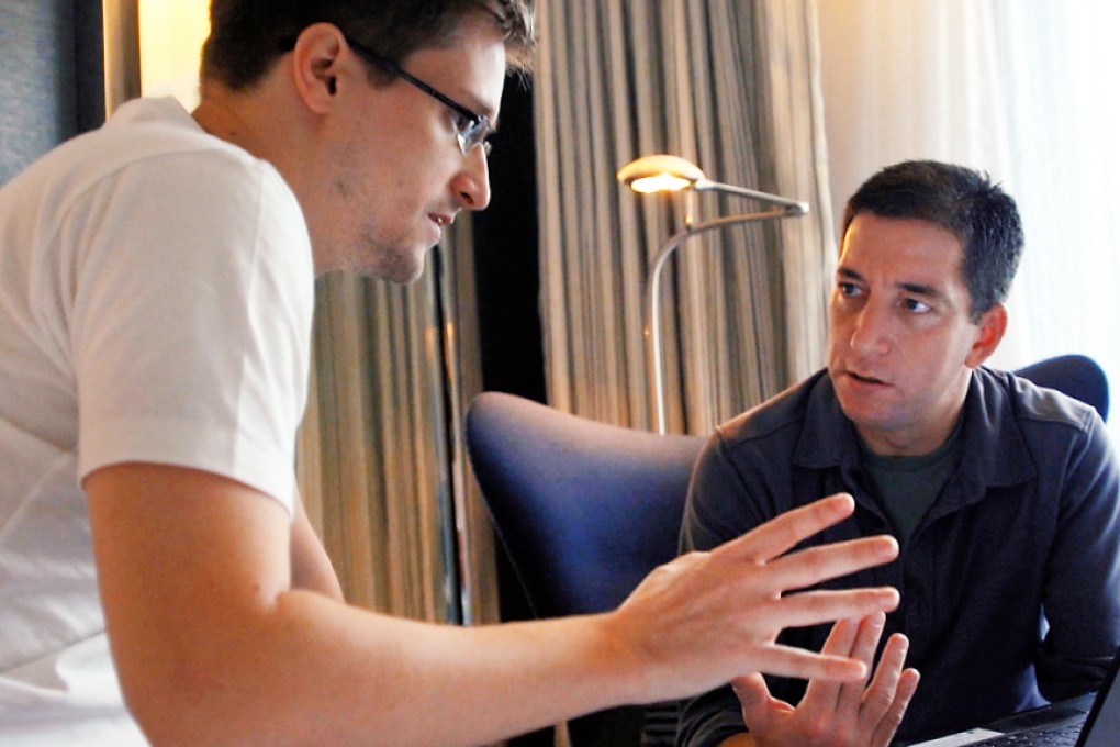 Edward Snowden is shown in Hong Kong talking to Glenn Greenwald, co-founder of The Intercept, which reported the latest leaks. Photo: SCMP Pictures