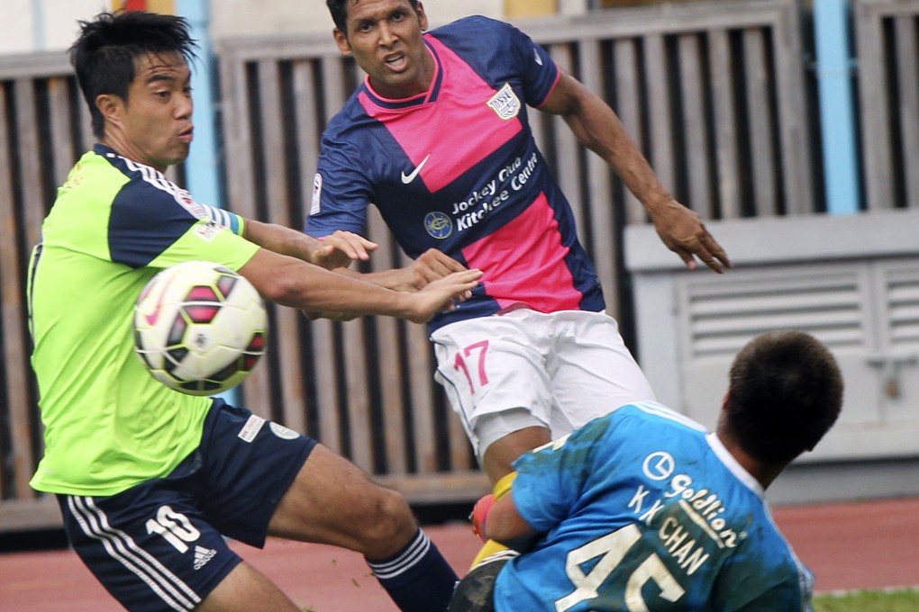 Wofoo Taipo's Lui Chi-hing (left) and Kitchee's Paulo Carreiro in action during a Hong Kong Premier League match on May 2. Photo: May Tse