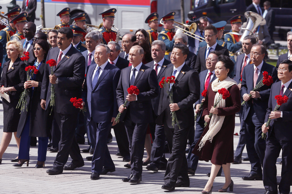 President Xi Jinping and his wife, Peng Liyuan, joined dignitaries honouring soldiers killed in the second world war at Moscow’s Victory Day parade in May. Photo: AP