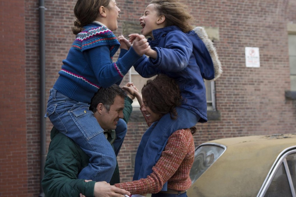 Family fun: Mark Ruffalo with co-star Zoe Saldana (right) and onscreen children in stills from the film.