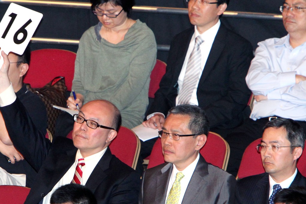 Developers bid on a plot of land at a government auction. Hong Kong land prices will keep rising as developers rush to buy sites amid strong property sales. Photo: Felix Wong