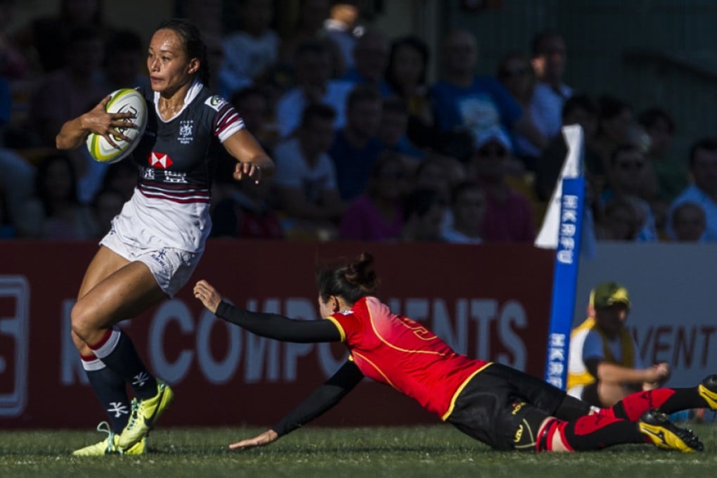 Christy Cheng Ka-chi slips a tackle against China during last year's Hong Kong Asian Sevens tournament. Photos: HKRFU