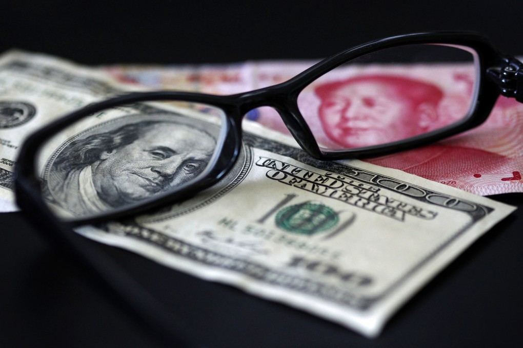 The dollar and the yuan are seen under spectacles as the Chinese currency may turn out to be vital in managing its capital account opening, exchange rate stability and monetary policy autonomy. Photo: Reuters