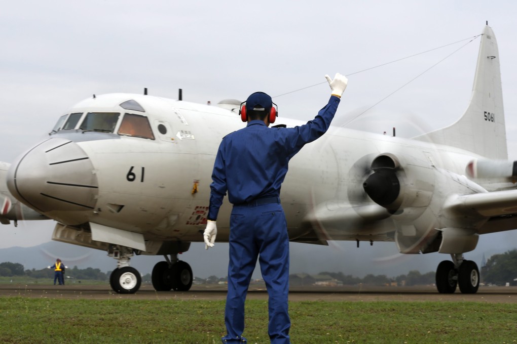 A Japanese patrol plane sets off on a flight over parts of the South China Sea claimed by China during a drill with the Philippine military on June 24. Photo: EPA