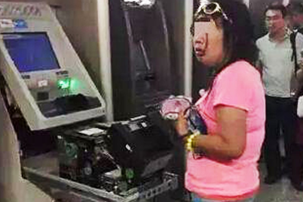 A bank employee expressed surprise that the woman had managed to rip the front off the cash machine. Photo: SCMP Pictures