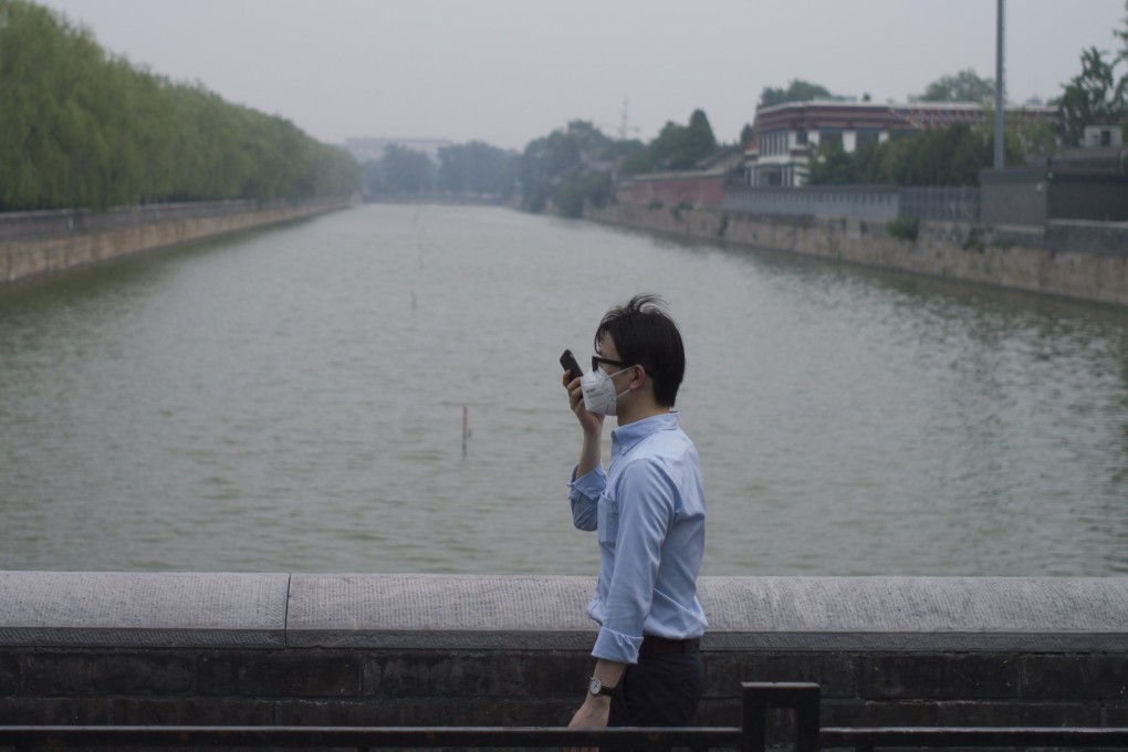 Another smoggy day in Beijing. Scientists and students should be funded to design affordable air filters and user-friendly masks. Photo: AFP
