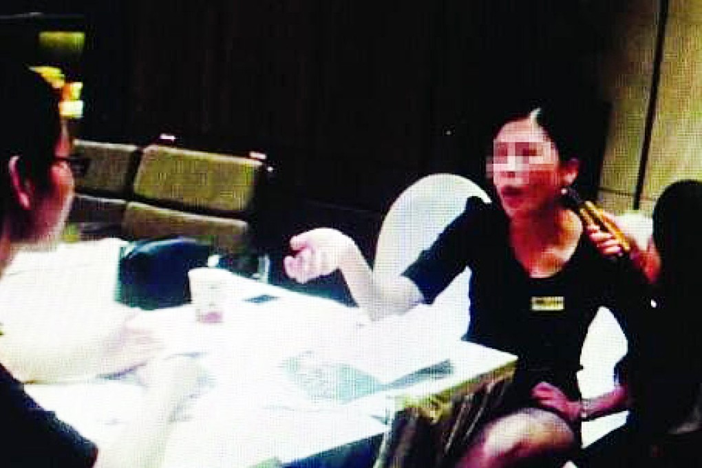 The estate agent is threatened with a knife. Photo: SCMP Pictures