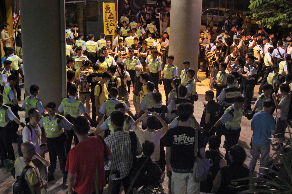 The protest outside the Grand Hyatt, where Li Fei was staying.