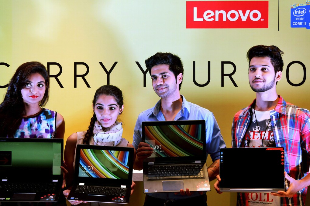 Models pose at a recent Lenovo product launch event in Bangalore, India. The firm's parent company Legend Holdings had a successful IPO in Hong Kong this week. Photo: EPA