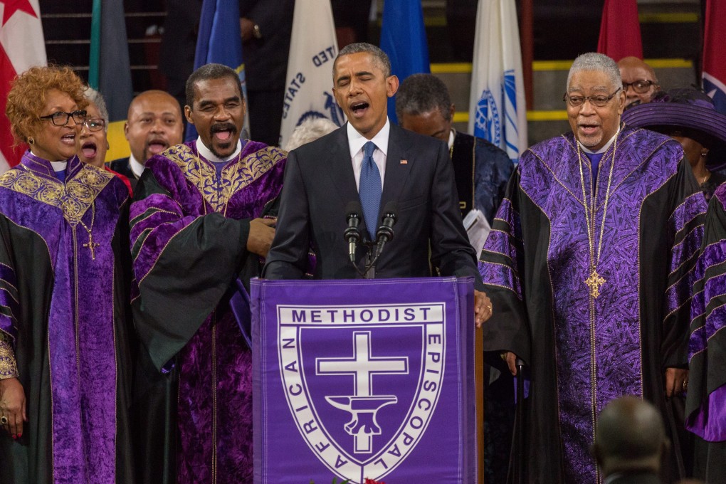 US President Barack Obama sings Amazing Grace during the eulogy. Photo: EPA