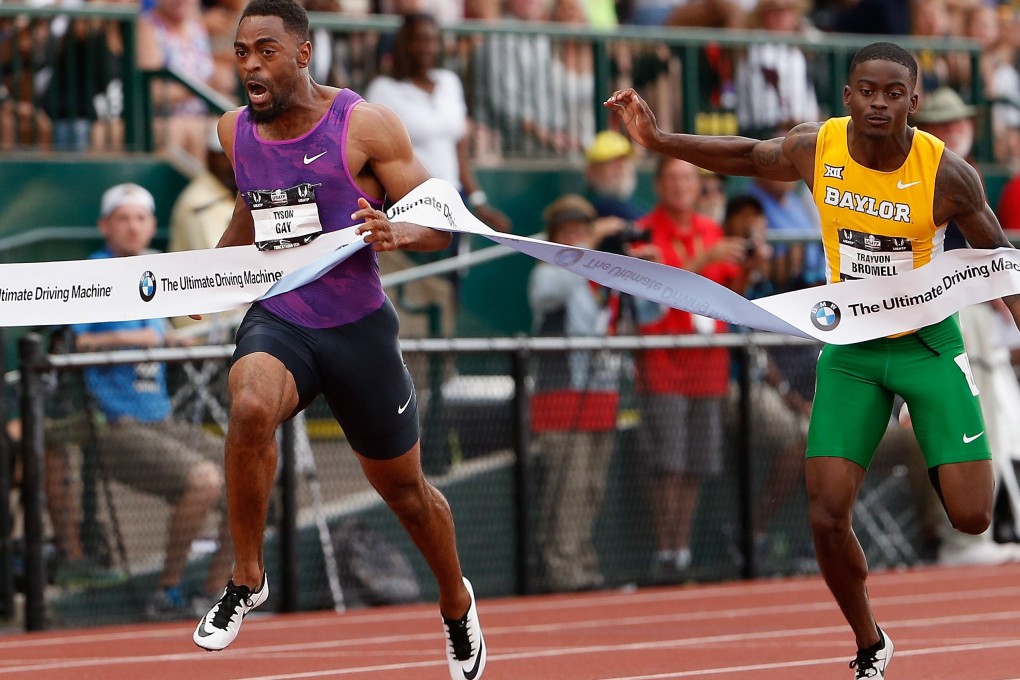 Tyson Gay hits the tape to win the 100 metres ahead of Trayvon Bromell. Photo: AFP