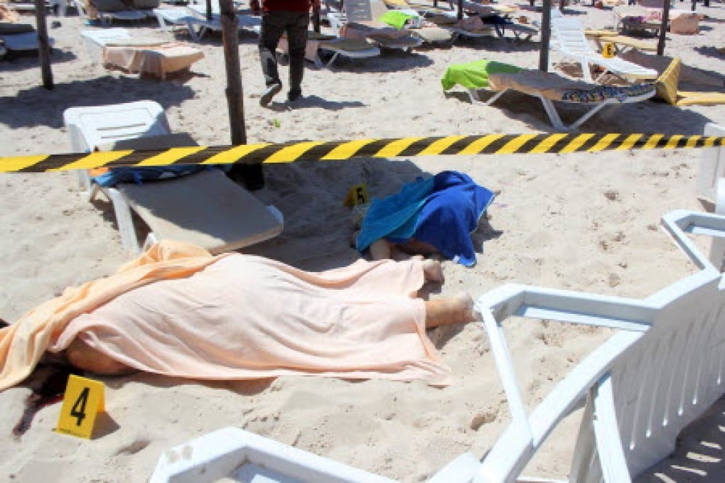 Bodies lie on a beach in at the hotel near Sousse, Tunisia, after two gunmen opened fire. Photo: EPA