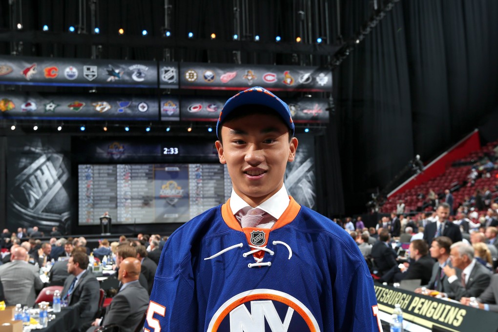 Song Andong shows off his jersey after being selected by the  New York Islanders. Photo: AFP