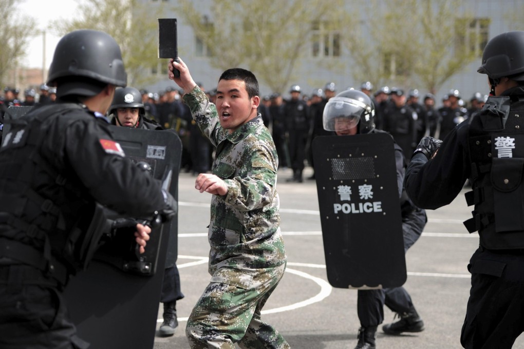 Riot police take part in a security drill in Urumqi. Hundreds of people have been killed in the region in the past few years, most in violence between Uygurs and ethnic majority Han Chinese. Photo: Reuters
