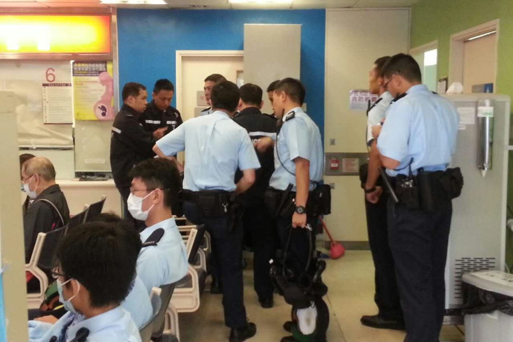 Police investigate at Queen Elizabeth Hospital in Yau Ma Tei. Photo: SCMP Pictures