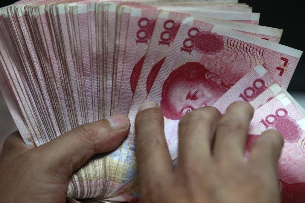 A stack of Chinese yuan notes is counted off in a bank as analysts brace for its possible addition into the IMF's SDR currency basket at a review later in the year. Photo: Reuters