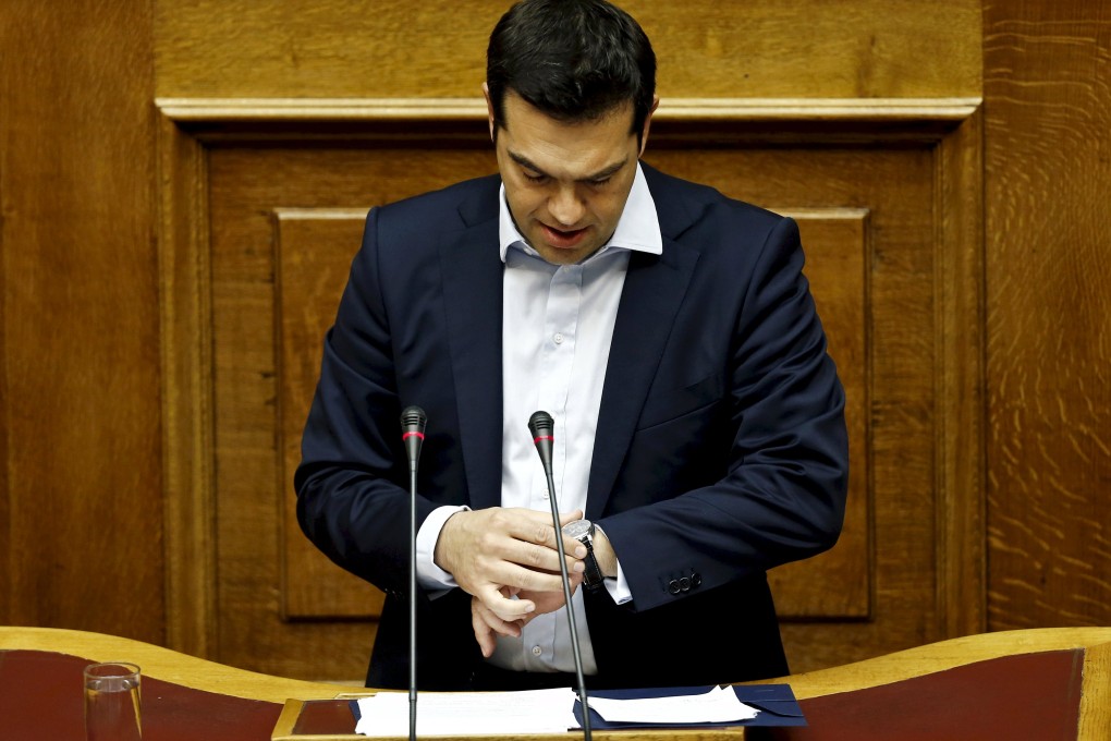 Greek Prime Minister Alexis Tsipras looks at his watch, as he called for a referendum on July 5 whether to accept the demands of international creditors in protracted debt talks with the country. Photo: Reuters