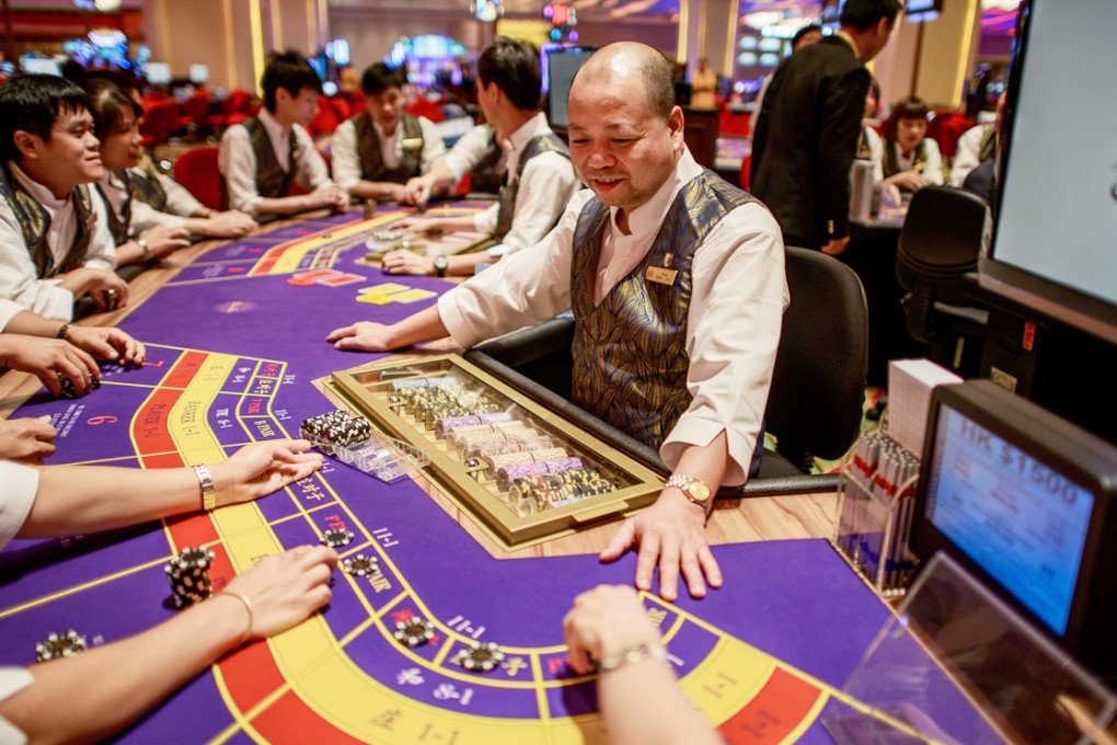 The gaming table in Sands China, whose shares and those of other major companies in Hong Kong, were pounded in a market rout on Monday. Photo: AFP