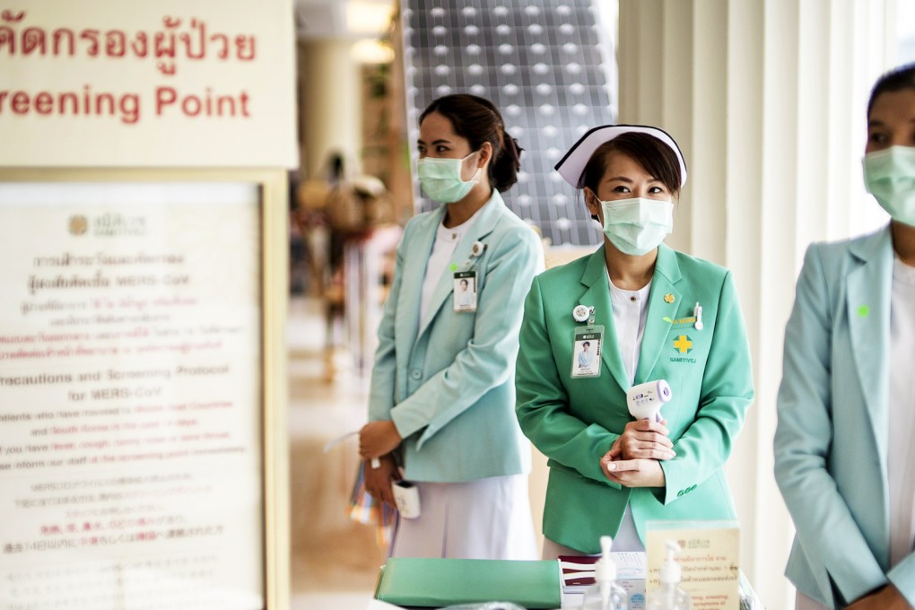 Medical personnel wear masks to prevent contracting Middle East Respiratory Syndrome (MERS) as they work at a screening point at a private hospital in Bangkok. Photo: Reuters